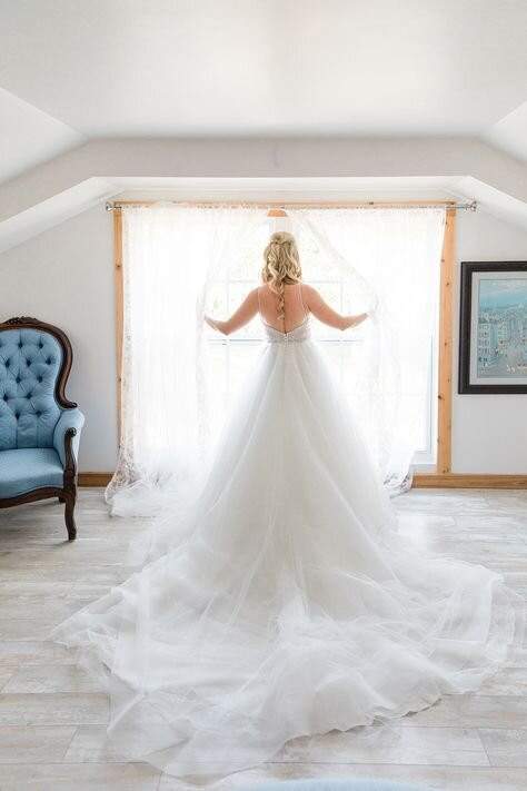 Picture of a bride looking through a window
