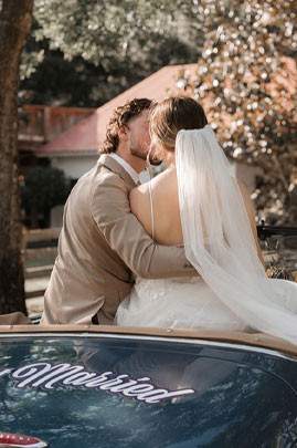 a bride and groom kissing