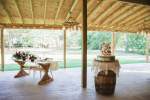 a pavilion with the bride and groom table next to the wedding cake
